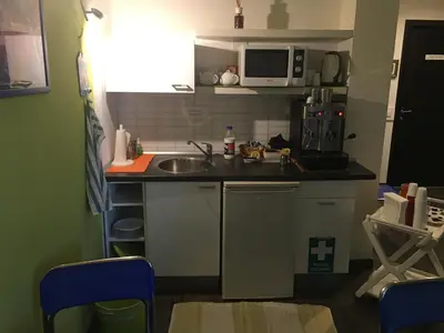 a small kitchen with a sink and a microwave at Almi Rooms in Rome