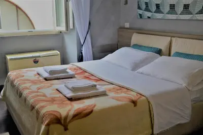 a bedroom with a bed with two towels on it at Art And Relax Suites in Rome