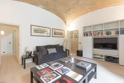 a living room with a couch and a table at Amazing 4 bedrooms apartment with garden in Rome