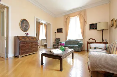 a living room with a couch and a coffee table at Vatican House Via Terenzio in Rome