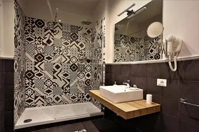 a bathroom with a sink and a shower at romantica guest house in Rome