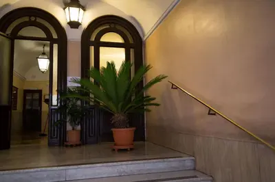 a hallway with a potted plant in a building at Chroma Italy - Chroma Deka in Rome