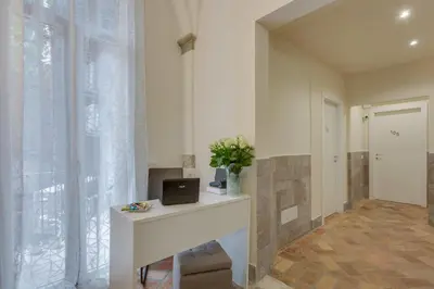 a room with a desk with a laptop on it at Navona Charme Suite in Rome