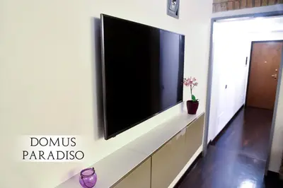a flat screen tv on a wall in a living room at Domus Paradiso in Piazza Navona in Rome