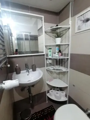 a bathroom with a sink and a toilet and a mirror at Da Adriana al vaticano in Rome