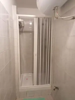 a bathroom with a shower with a glass door at Da Adriana al vaticano in Rome