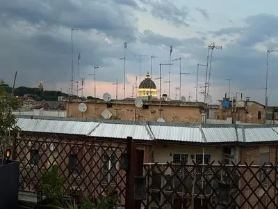 a building with a dome on top of it at Dome Terrace Apartment in Rome