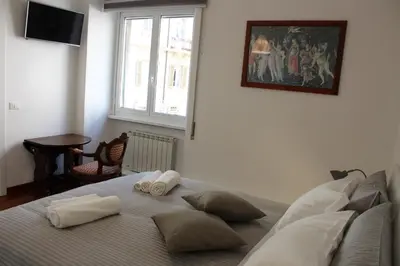 a bedroom with a bed with two pillows on it at B&B CultRoma Roof Garden in Rome