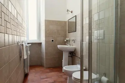 a bathroom with a sink and a toilet and a shower at B&B Domus Quiritum in Rome