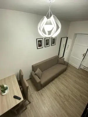 a living room with a couch and a table at The Place In Rome Guest House in Rome