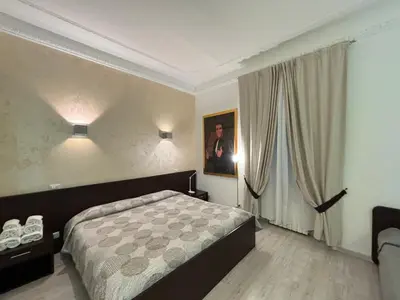 a hotel room with a bed and a window at Chroma Italy - Chroma Tessera in Rome