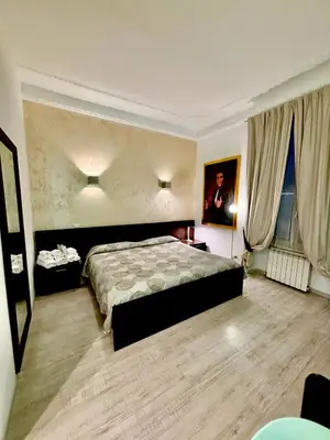 a hotel room with a bed and a window at Chroma Italy - Chroma Tessera in Rome