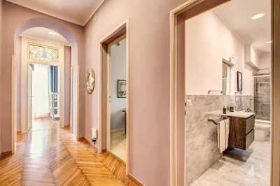 a bathroom with a shower and a sink and a mirror at The Great Retrò in Rome