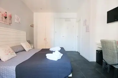 a bedroom with a bed with towels on it at Le Cupole in Rome