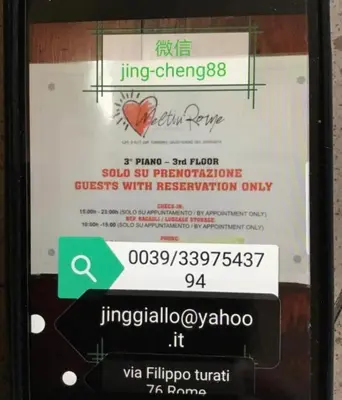 a sign on a cell phone with a ticket at Meltin' Rome Guest House in Rome