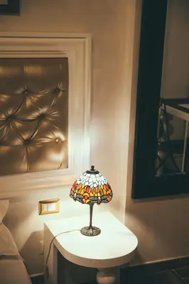 a lamp on a table in a room at Lighthouse Suites Trastevere in Rome