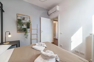 a bedroom with a bed with towels on it at CS Campo de'Fiori - Navona Amazing Terrace Apartment in Rome