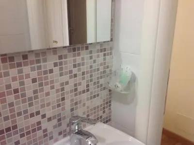 a bathroom with a sink and a mirror at Residenza Fermi in Rome
