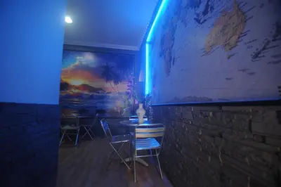 a room with two chairs and a table with a map on the wall at Hotel Beauty in Rome