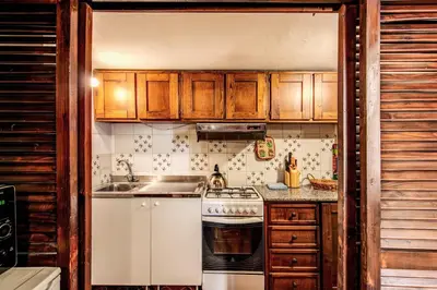 a kitchen with a stove and a sink at La Scala in Rome