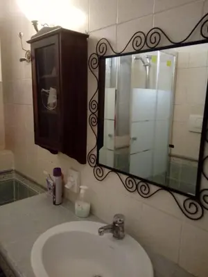 a bathroom with a sink and a mirror at Max House in Rome
