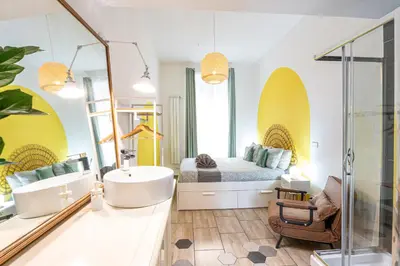 a bathroom with a bed and a tub and a sink at BigFamilyRome - Testaccio Riverside in Rome