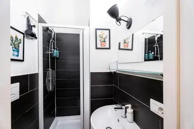 a bathroom with a sink and a mirror at BigFamilyRome - Testaccio Riverside in Rome