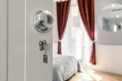 a room with a door with a bed and a window at Bed And Best in Rome