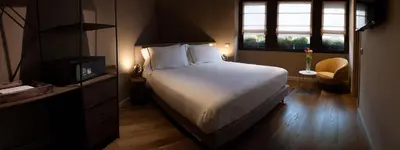 a bedroom with a bed and a television and a window at The Place in Rome