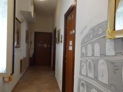 a hallway with a drawing on the wall at B&B Twins in Rome