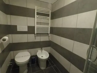 a bathroom with a toilet and a sink at Julius Caesar 183 in Rome