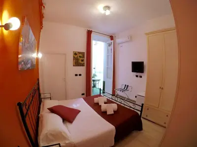 a bedroom with a white bed and a window at Julius Caesar 183 in Rome