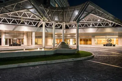 an exterior view of a building at night at Ergife Palace Hotel in Rome