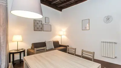 a living room with a table and a couch at Rental in Rome Pelliccia in Rome