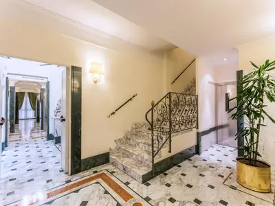 a staircase in a room with a stair case at Raeli Hotel Regio in Rome