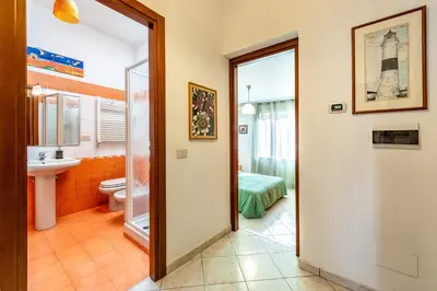 a bathroom with a toilet and a sink at Apartment Angelo Emo 69 in Rome