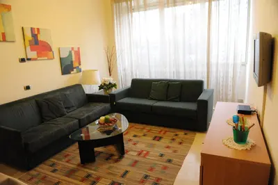 a living room with a couch and a coffee table at Lux Appartamenti in Rome
