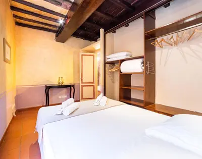 a bedroom with two beds in a room at maison specchi in Rome