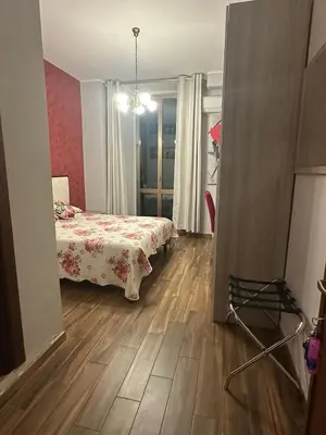 a bedroom with a bed and a wooden floor at Royal Termini in Rome