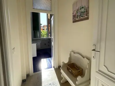 a hallway with a door leading to a room with a window at Domus Claudia San Giovanni in Rome