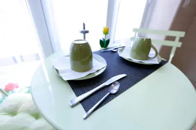a table with two hats and a cross on it at Marco Polo Vatican APARTMENT Metro A 2 min - San Pietro 10 min in Rome