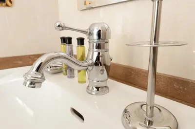 a bathroom sink with a chrome faucet at Dimora storica Palazzo Marescalchi Belli in Rome