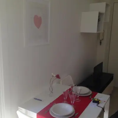 a table with plates and wine glasses on it at flaminio heart house in Rome