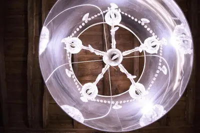 a metal clock with lights on a wooden wall at H-Aviva Giubbonari Apartment in Rome