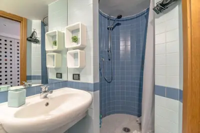 a bathroom with a sink and a shower at Loft 60 - EXCLUSIVE LOFT ROME CITY CENTER in Rome