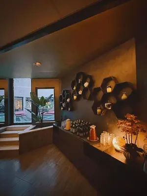 a living room with a bunch of lights on the wall at The Hive Hotel in Rome
