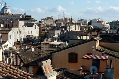 a view of a city with buildings and roofs at Daplace - La Mongolfiera Rooms in Navona in Rome