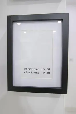 a framed picture of a frame with a clock on it at Caffe' e Cuscino in Rome