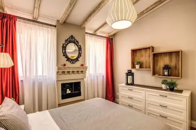 a bedroom with a bed and a fireplace at Attic with Terrace by Trevi Fountain in Rome