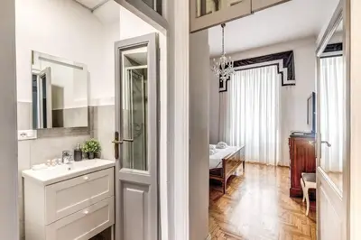 a bathroom with a sink and a mirror at Lovely renovated flat by Vatican in Rome